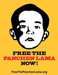 Display posters of the Panchen Lama ...
